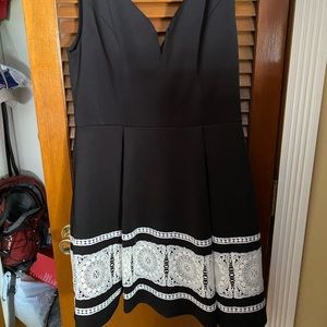 Francesca’s large black dress with embroidered detail